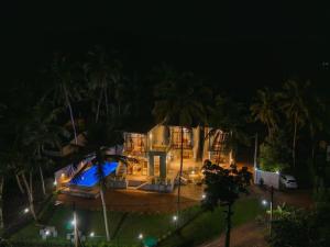 an aerial view of a house at night at Villa Rivora Wadduwa in Wadduwa +10 photos