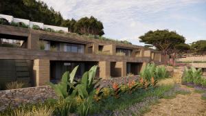 a house with a garden in front of it at Nômade Temple Ibiza in Sineu