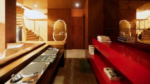 a bathroom with a sink and a red counter at Nômade Temple Ibiza in Sineu