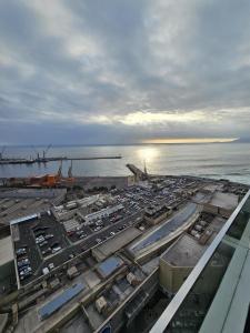 an aerial view of a harbor with a lot of cars at Experencia Puerto Nuevo-1hab-1Bano in Antofagasta +3 photos