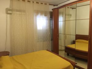 A bed or beds in a room at Sacca House