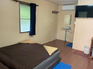 Postel nebo postele na pokoji v ubytování Go Gear Travel & Bungalow