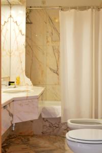 a bathroom with a sink and a toilet and a shower at Pousada de Viana do Castelo in Viana do Castelo