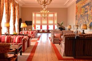 a living room with couches and a chandelier at Pousada de Viana do Castelo in Viana do Castelo