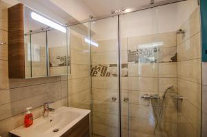 a bathroom with a shower and a sink at Ios Sea View in Ios Chora +10 photos
