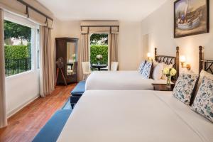 a hotel room with two beds and a window at The Milo in Santa Barbara