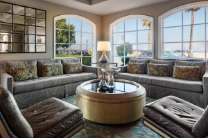 a living room with couches and a coffee table at The Milo in Santa Barbara