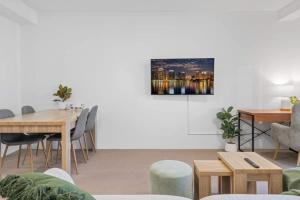 a living room with a table and chairs at The Beachside - High Floor Ocean View 2BDR with Parking Pool & Gym in Gold Coast