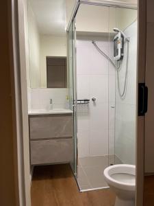 a bathroom with a shower and a toilet at Mini Apartment Ares 2 in Lima +20 photos