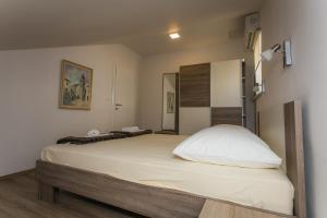 Postel nebo postele na pokoji v ubytování Apartments Marin