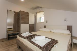 Postel nebo postele na pokoji v ubytování Apartments Marin