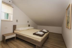 Postel nebo postele na pokoji v ubytování Apartments Marin