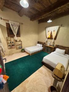 Ένα ή περισσότερα κρεβάτια σε δωμάτιο στο Tatrbent Siwa تاطربنت سيوة