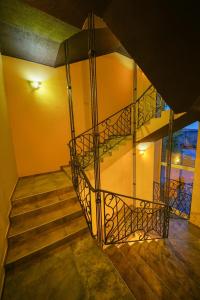 a stairway leading up to a staircase at Hostel Gosti Krasnodar in Pashkovskiy