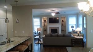 a living room with a couch and a fireplace at Peachtree TownHome in Peachtree City