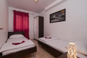 Posteľ alebo postele v izbe v ubytovaní Apartment Božan