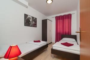 Posteľ alebo postele v izbe v ubytovaní Apartment Božan
