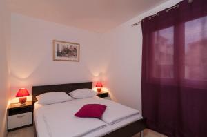 Posteľ alebo postele v izbe v ubytovaní Apartment Božan