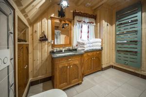 a bathroom with a sink and a mirror at Willa Irena in Kościelisko +104 photos