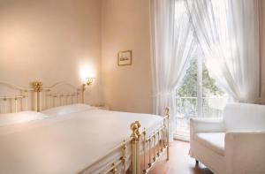 Voodi või voodid majutusasutuse Hotel Settentrionale Esplanade toas