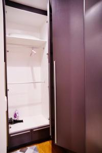 a walk in closet with the door open at Lucentia Residence Bukit Bintang By Panorama in Bukit Bintang