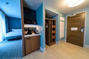 a room with a bedroom with a bed and a door at Hilton Garden Inn Dayton Downtown in Dayton +35 photos