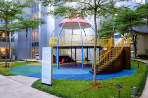 a playground in front of a building at Premium Taman Anggrek Residences in Jakarta