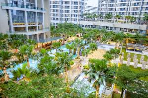 an aerial view of a resort with palm trees at Premium Taman Anggrek Residences in Jakarta