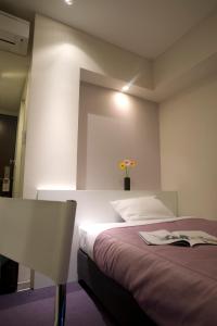 Postel nebo postele na pokoji v ubytování Nesthotel Alt Meguro Ekimae