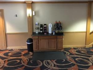 a room with a counter in a room with a carpet at Cabot Inn & Suites in Lancaster