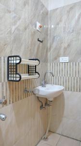 a bathroom with a sink and a shower at Happy Villa By Eden Luxury Stay in Ooty +69 photos