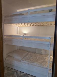 a couple of bunk beds in a room at Apartment am Rodelberg in Braunlage +8 photos