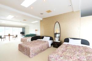 Ένα ή περισσότερα κρεβάτια σε δωμάτιο στο Sun Flower City Hotel +30 φωτογραφίες