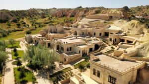 an aerial view of a house in a canyon at MDC Cave Hotel Cappadocia in Urgup