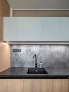 a kitchen with a sink and a counter top at Pokoj Harmonie 