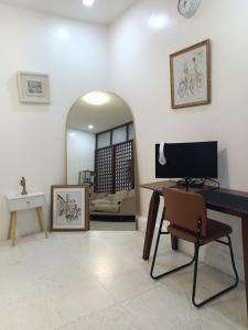 a living room with a desk and a mirror at Laika the Beagle's Home away from Home - Clark in Angeles