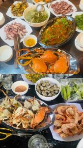 a table filled with many different types of food at Nhà Nghỉ Blue Sapphire Bình Châu Hotel in Xuyên Mộc