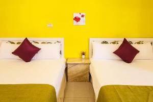 Postel nebo postele na pokoji v ubytování Zill Homestay