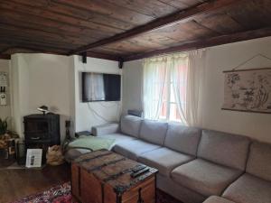 a living room with a couch and a window at Korsbacken in Tenhult
