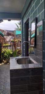 a kitchen with a sink in a room at Kua's Pad Batangas Tent in Calatagan