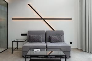 a living room with a couch and a table at Agkyra Boutique Hotel in Rhodes Town +40 photos
