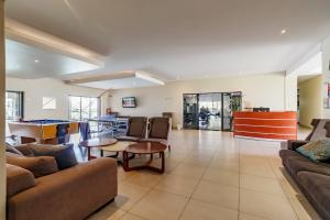 a living room with couches and a pool table at Modern 3-Bed Apartment Perfect for Family & Groups in Vosburg