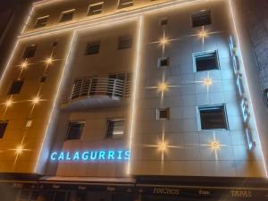a building with a sign on the side of it at Hotel Calagurris in Calahorra