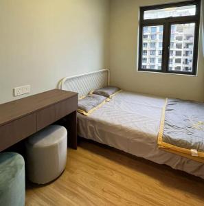 Ένα ή περισσότερα κρεβάτια σε δωμάτιο στο 精装修 2 房公寓