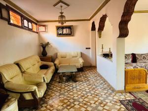 a living room with two couches and a table at gift for mom in El Jadida