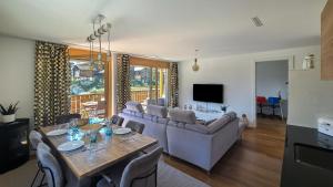 a living room with a couch and a table at Residenz Panorama - Blatten bei Naters VS in Blatten bei Naters +166 photos