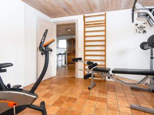 a gym with two exercise bikes in a room at Luxury Retreat with Spa - By Traum Ferienwohnungen in Hvide Sande