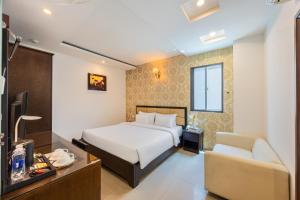 Postel nebo postele na pokoji v ubytování A25 Hotel - 29 Bùi Thị Xuân