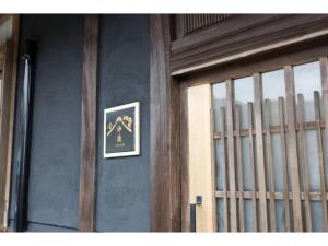 a door of a building with a picture on the wall at AWAJI PRIVATE VILLA Kagura - Vacation STAY 73007v in Awaji