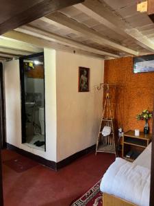 a living room with a room with a ladder in it at Moon Light Guest House in Bhaktapur